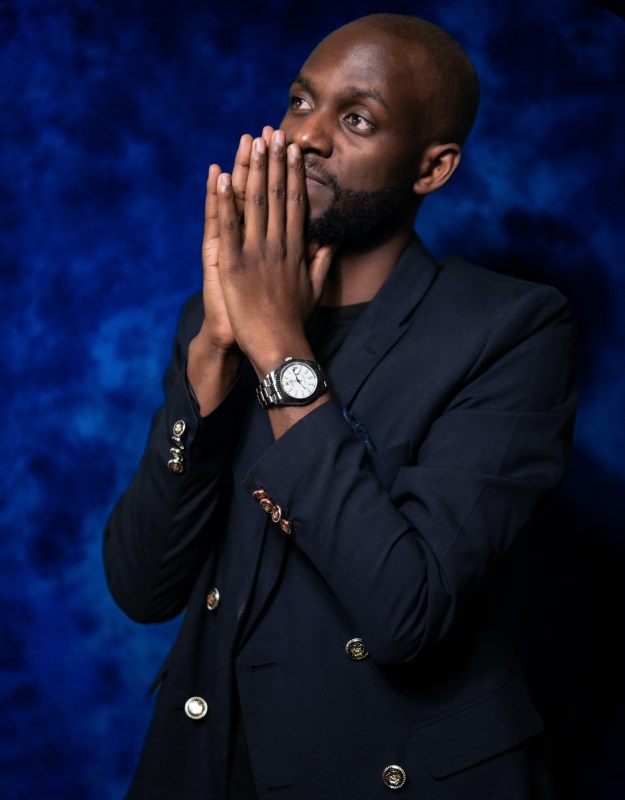 Man in an unbuttoned navy blazer