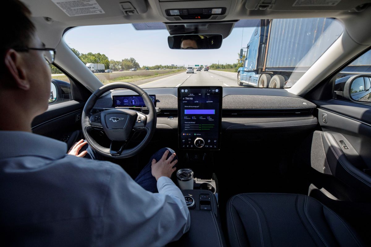 A driver using BlueCruise hands-free driving technology