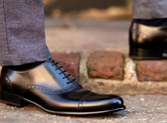 Man wearing black Paul Evans Captoe
