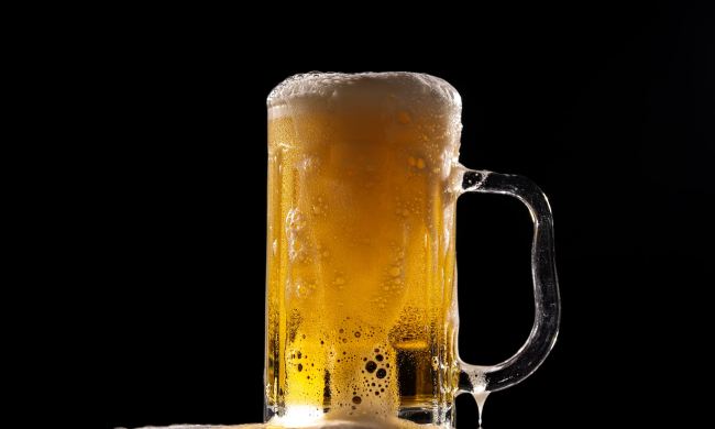 Glass of beer with a black background