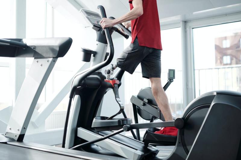 Man using elliptical.
