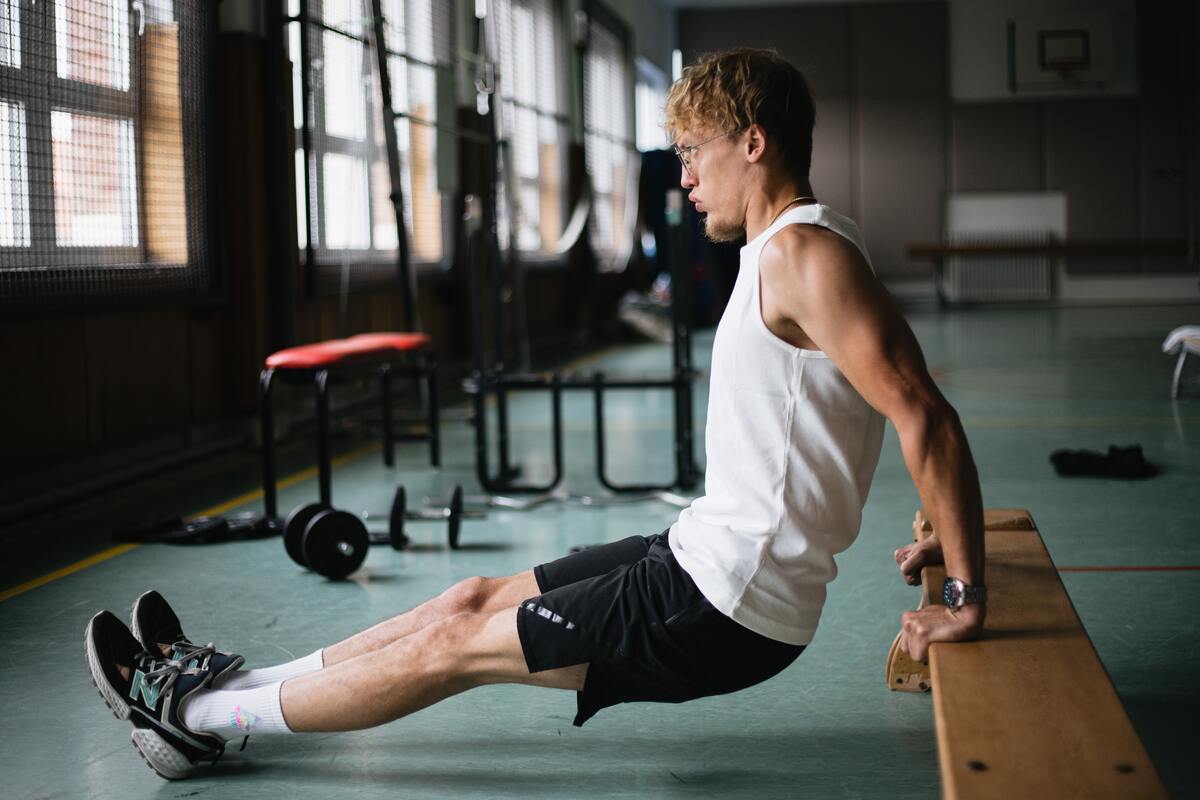 Man doing tricep dips.