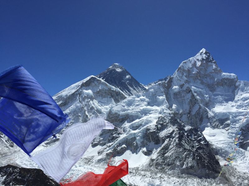 Mount Everest with prayer flags in the foreground