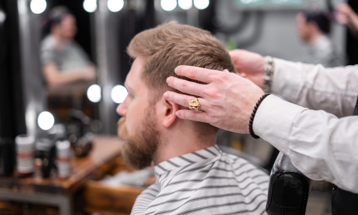 man consulting barber