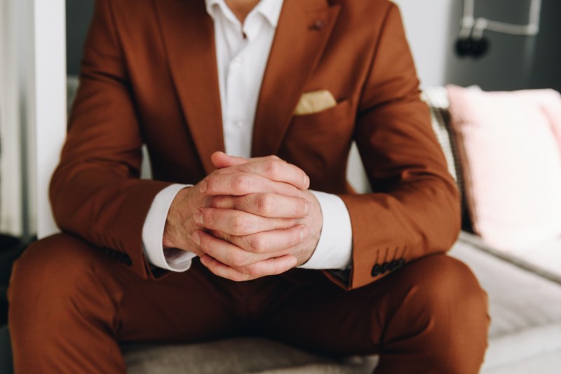 Man in brown suit