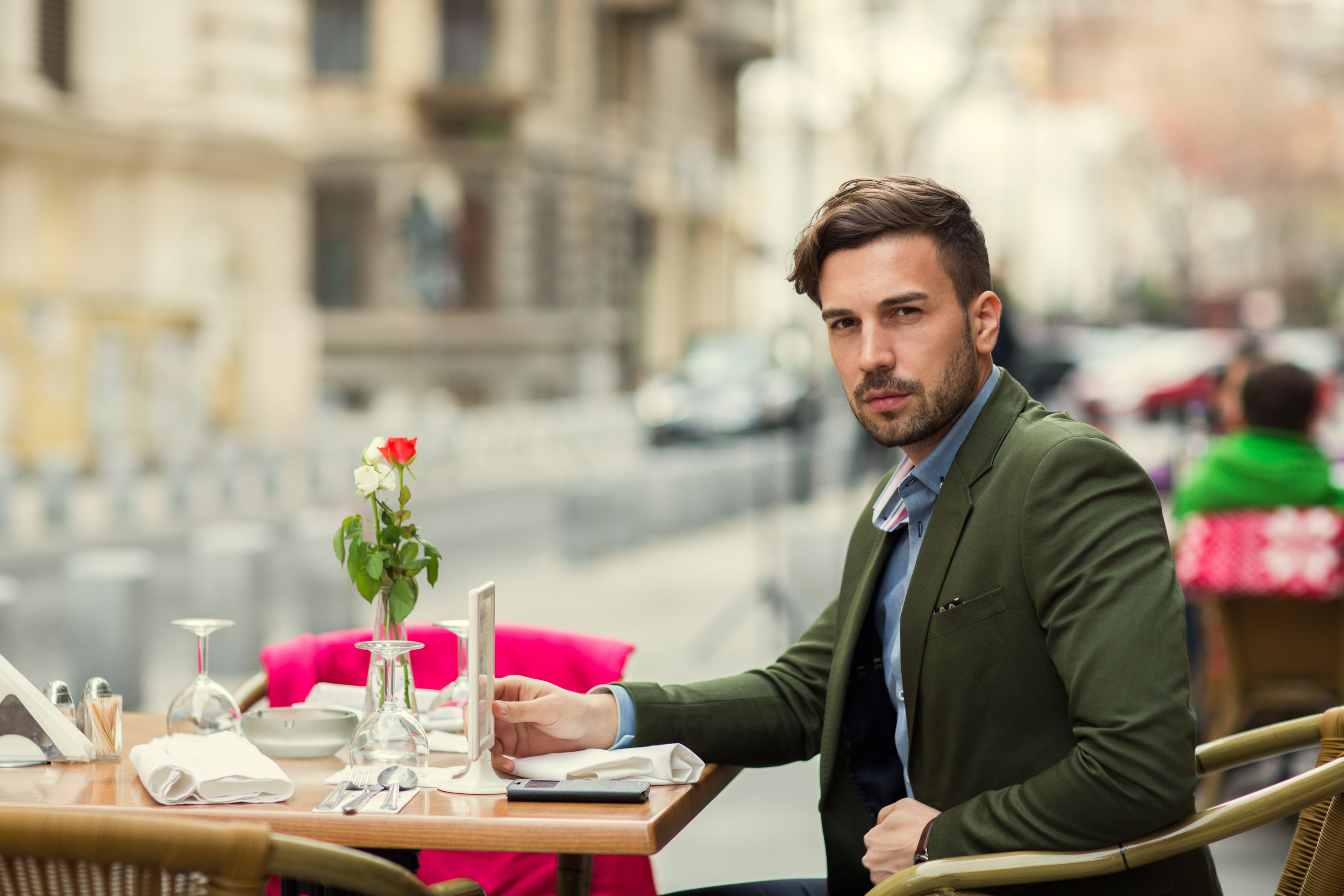 man in green suit jacket