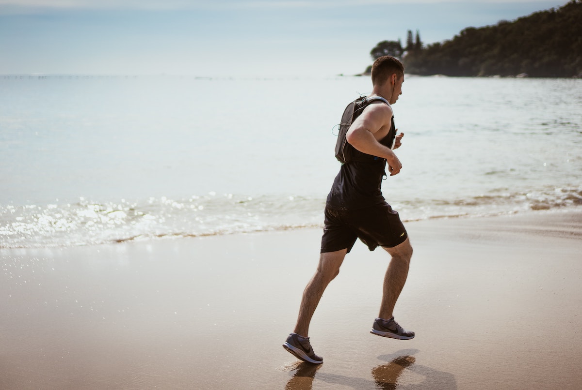 a man running on the beach