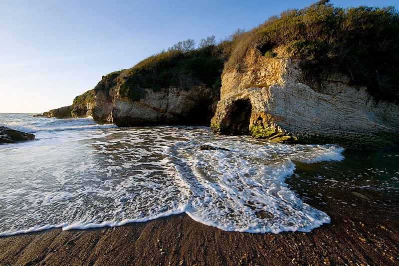 Surf crashing on the shore at Montaña de Oro State Park in San Luis Obispo, California.