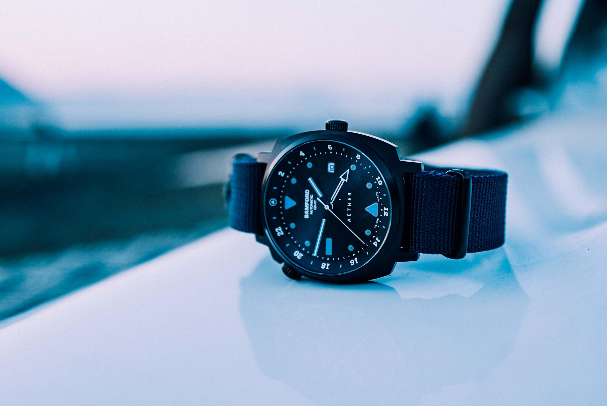 Aeford + Bamford collaboration watch set against blue background