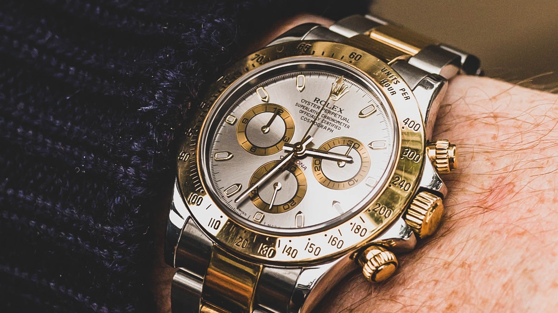 A Rolex Daytona on a wrist