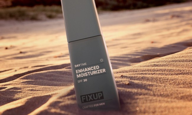 FixUp moisturizer bottle in sand