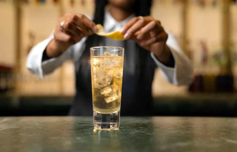 Bartender making a whiskey highball