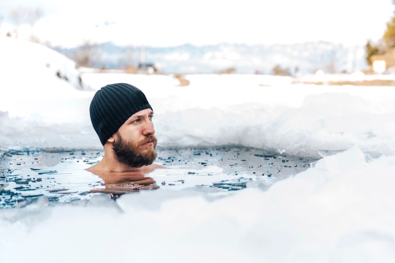 Man swimming in ice
