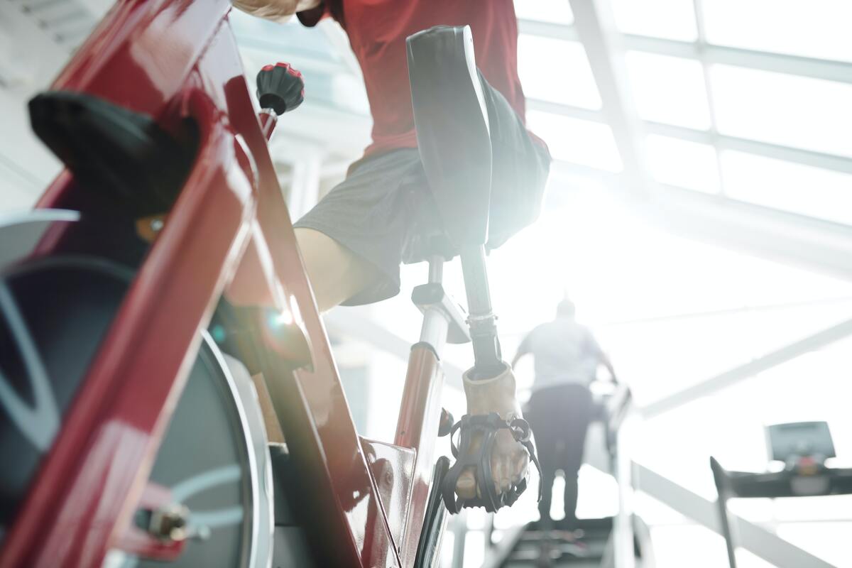 Man riding stationary bike.