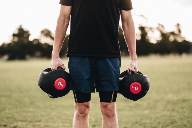 Man carrying weights.