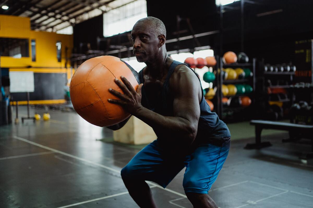 Man holding medicine ball.