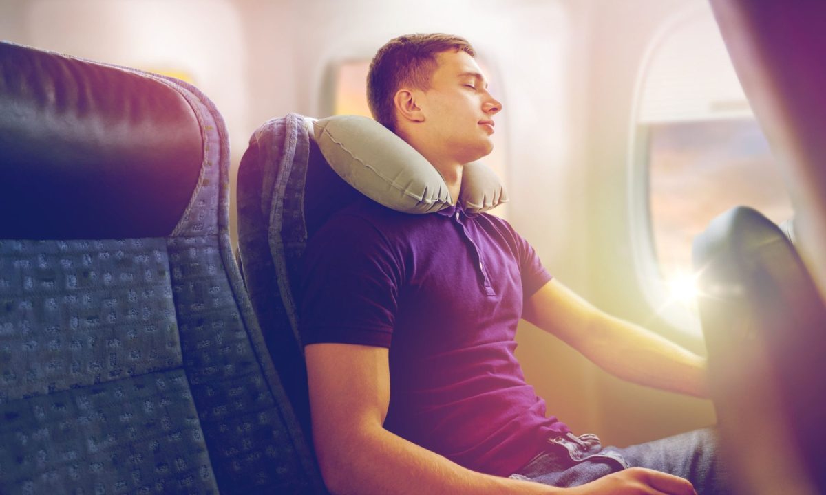 Man sleeping on a plane