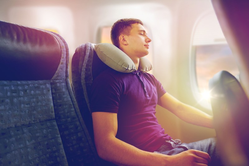 man sleeping on a plane