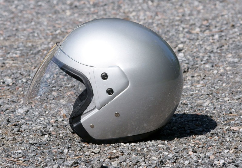 A side image of an open-faced motorcycle helmet.