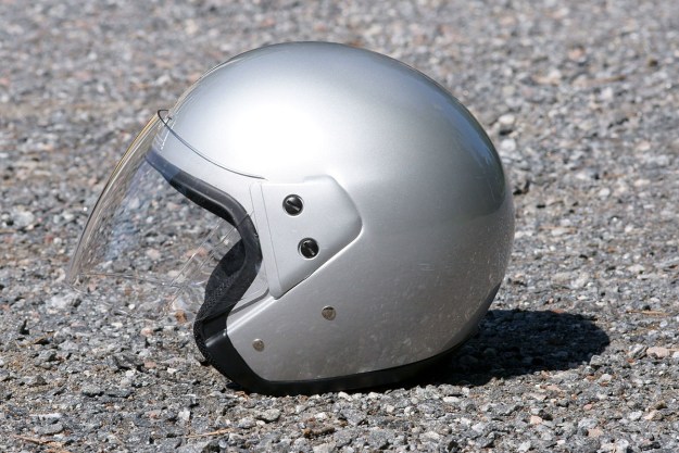 A side image of an open-faced motorcycle helmet.