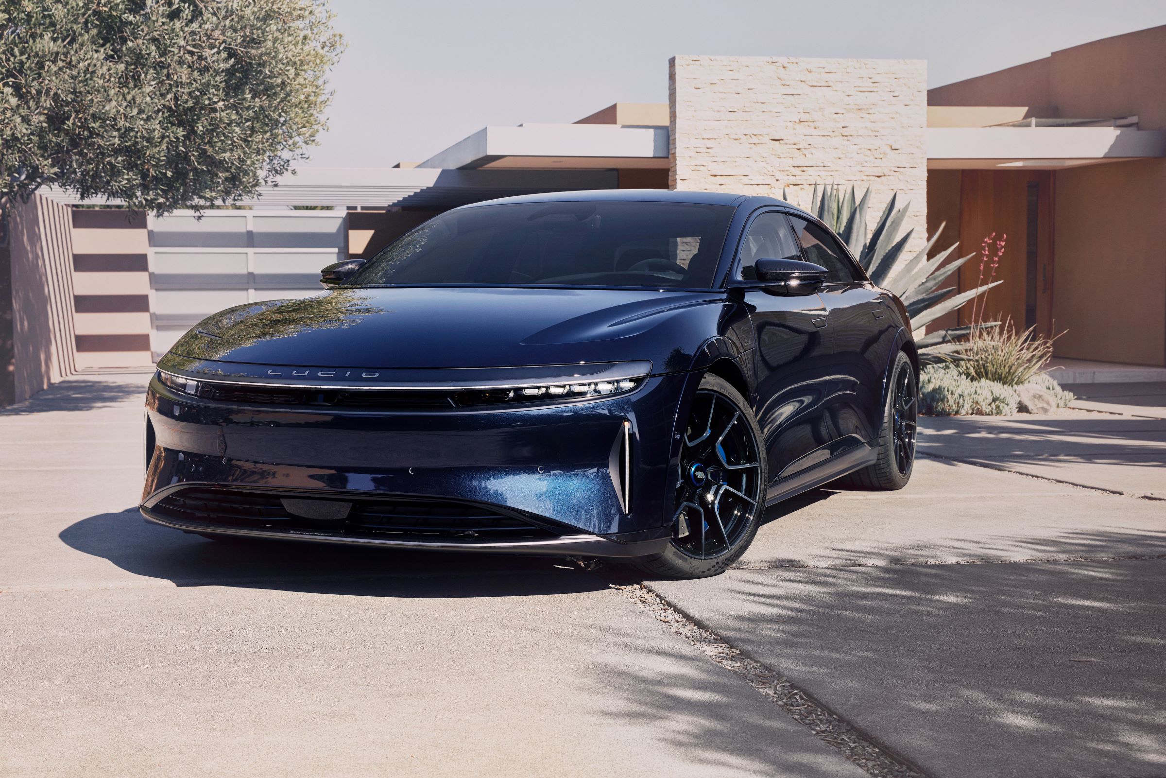 2024 Lucid Air Sapphire parked in front of a house.