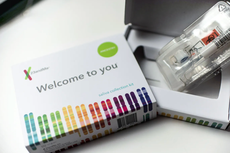 A 23andMe DNA Testing Kit on a table.
