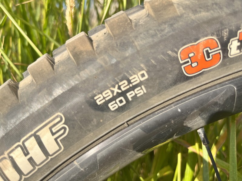 A close up of a mountain bike tire showing its size- 29x2.3