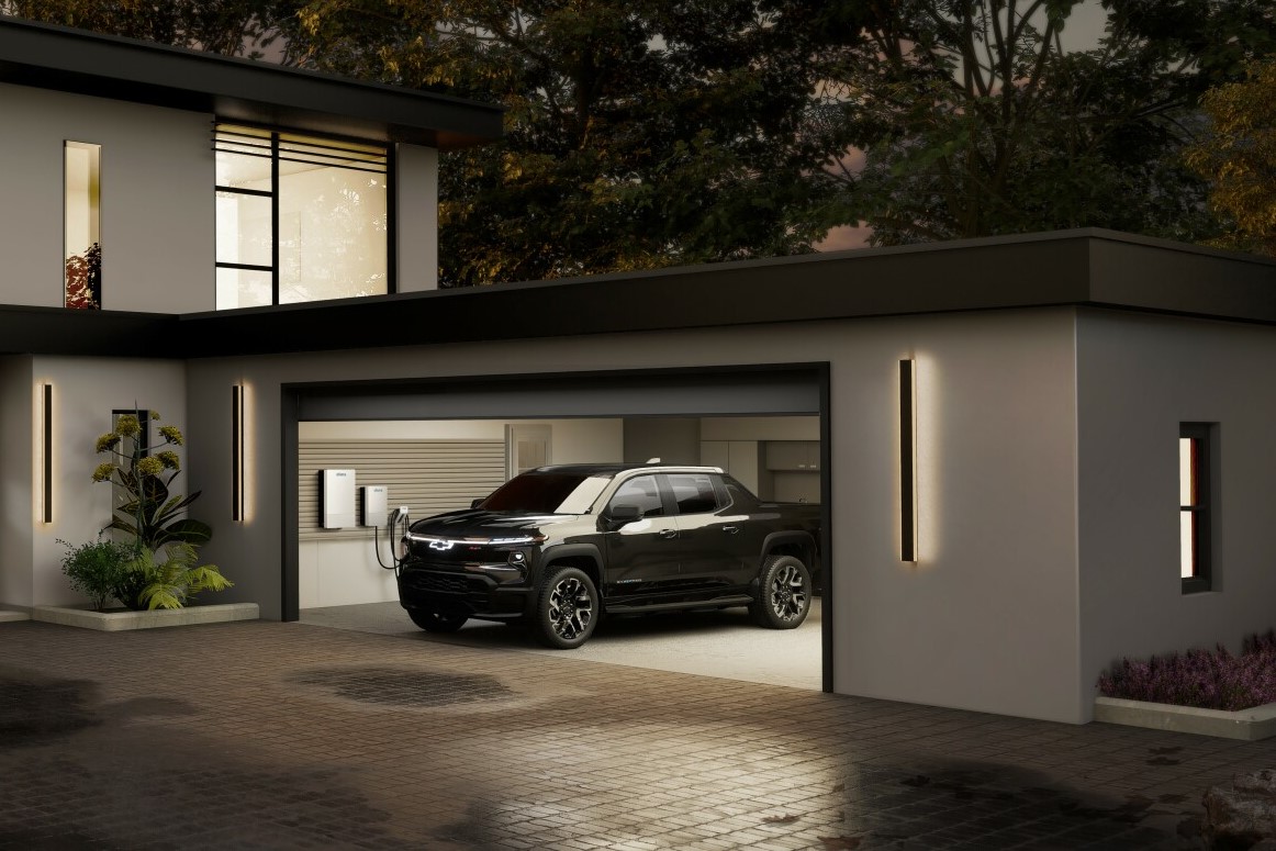 Chevy Silverado EV with V2H bidirectional charging capability connected to a home