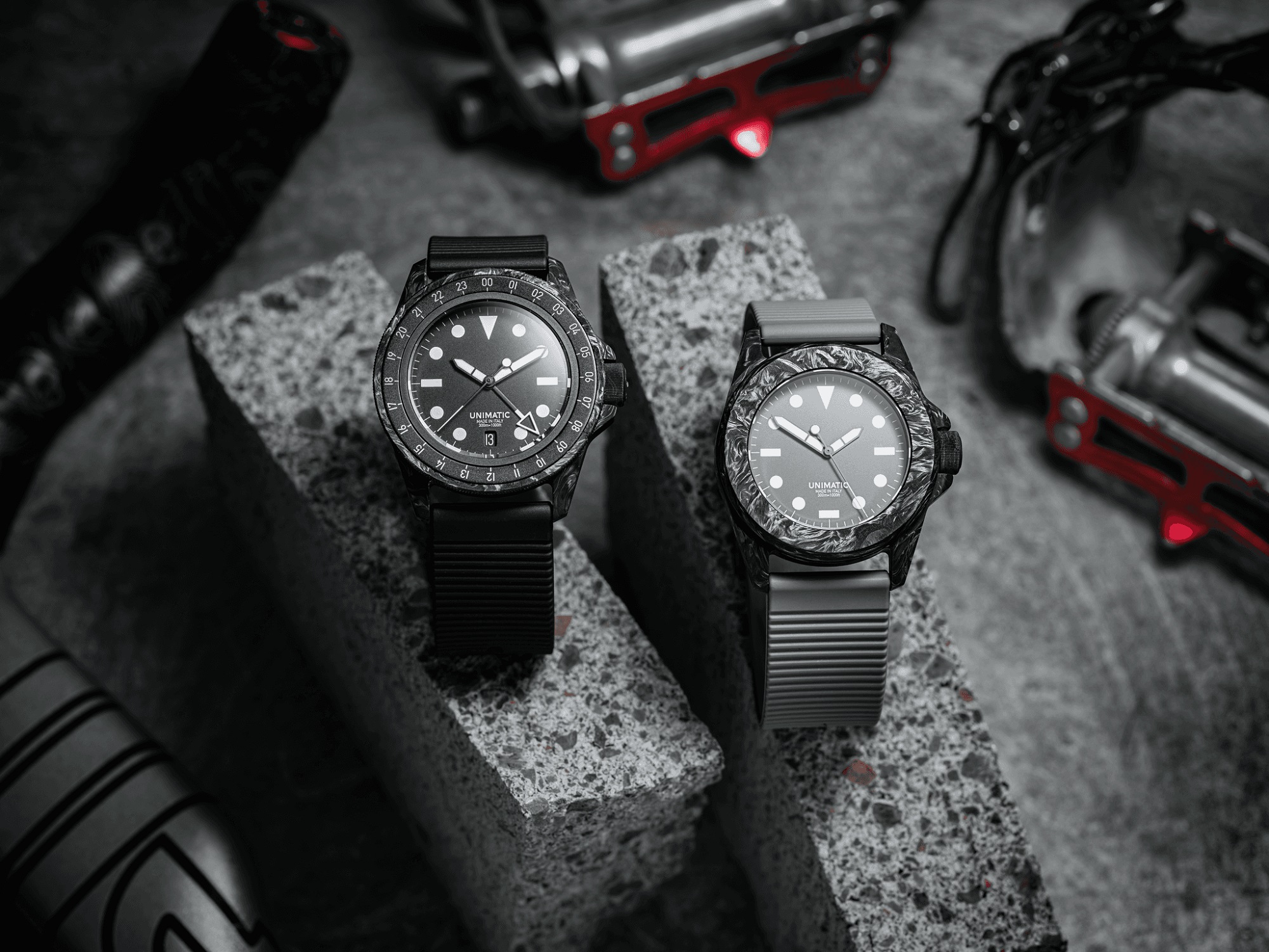 Hodinkee Unimatic collaboration watches on black and gray stone