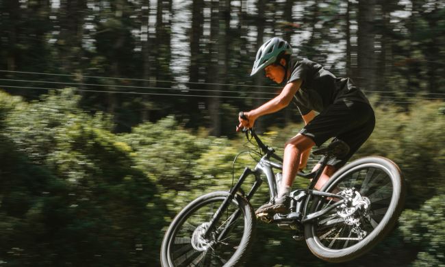 A mountain biker catches air