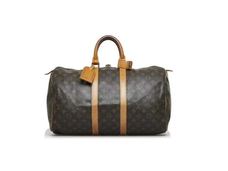 The Louis Vuitton Keepall with its handles in the air, as if ready to be picked up.