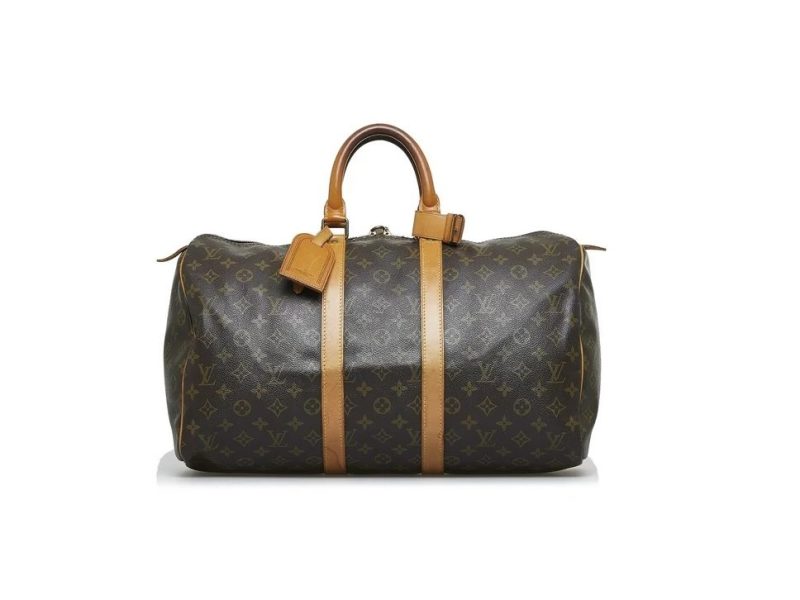 The Louis Vuitton Keepall with its handles in the air, as if ready to be picked up.