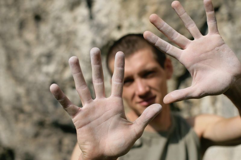 Man holding up callused palms of his hands