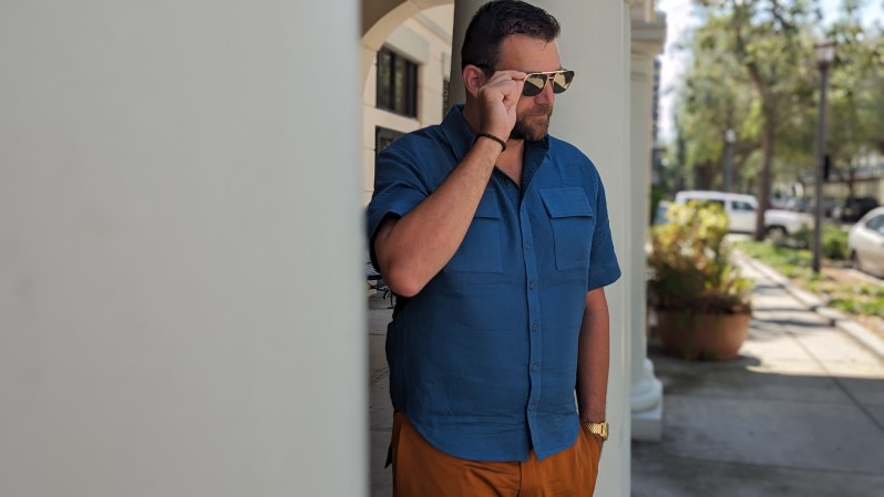 Man in blue shirt and orange pants