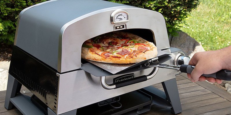 The Cuisinart 3-in-1 pizza oven with a pizza coming out.