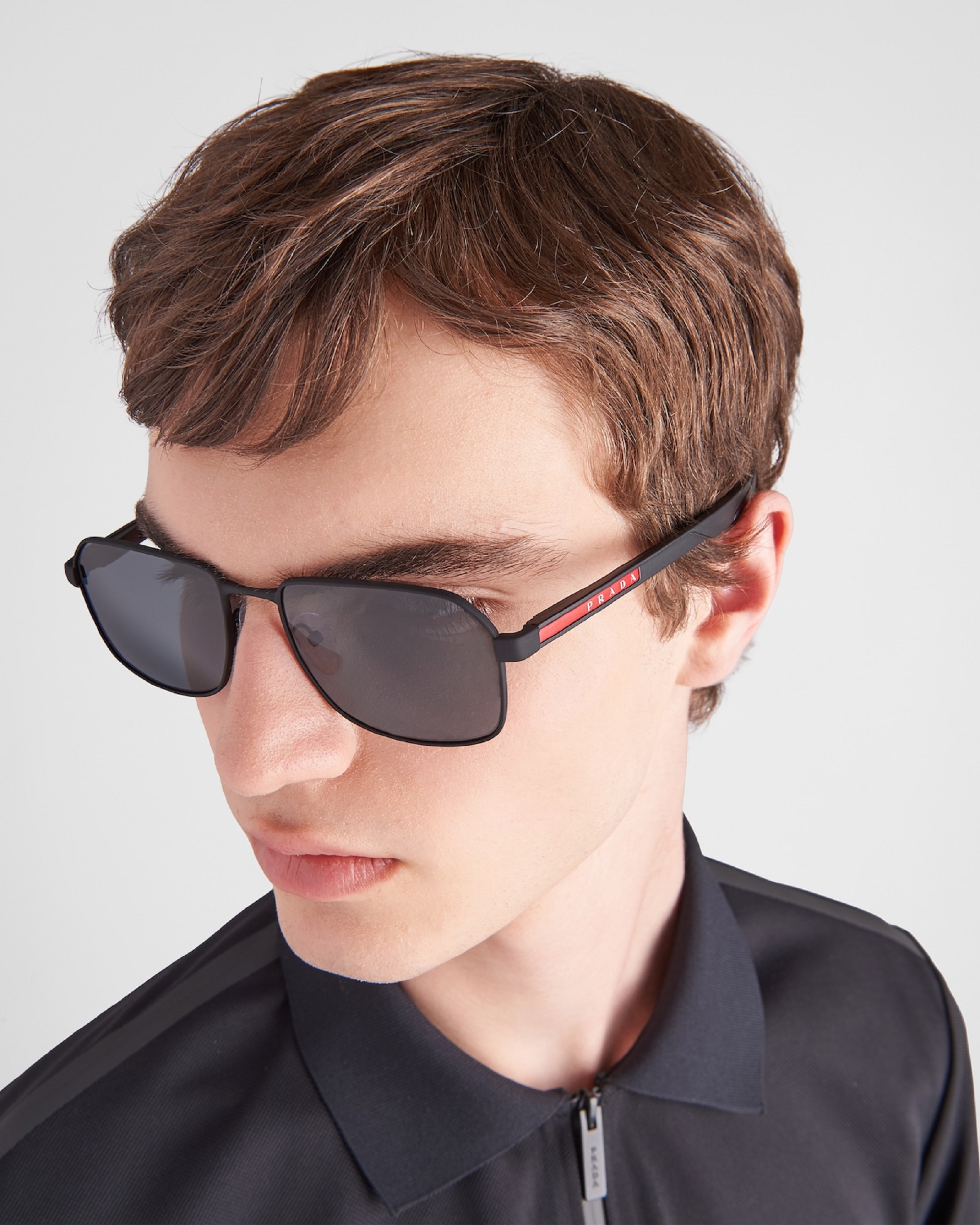 Man wearing Prada sunglasses
