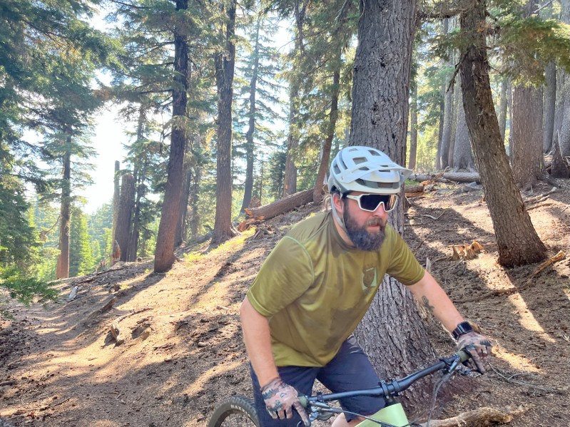 Climbing up a mountain biking trail using the Smith Shift MAG sunglasses