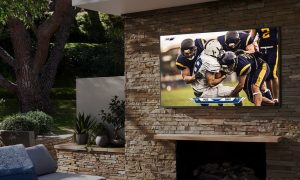 Samsung The Terrace outdoor-ready QLED smart TV lifestyle image on patio.