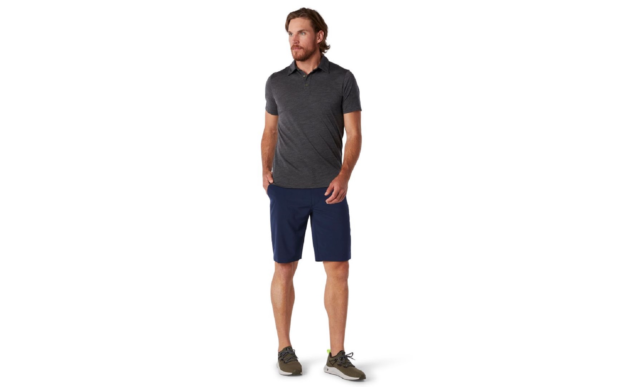 Man wearing a Smartwool polo, shorts, and sneakers