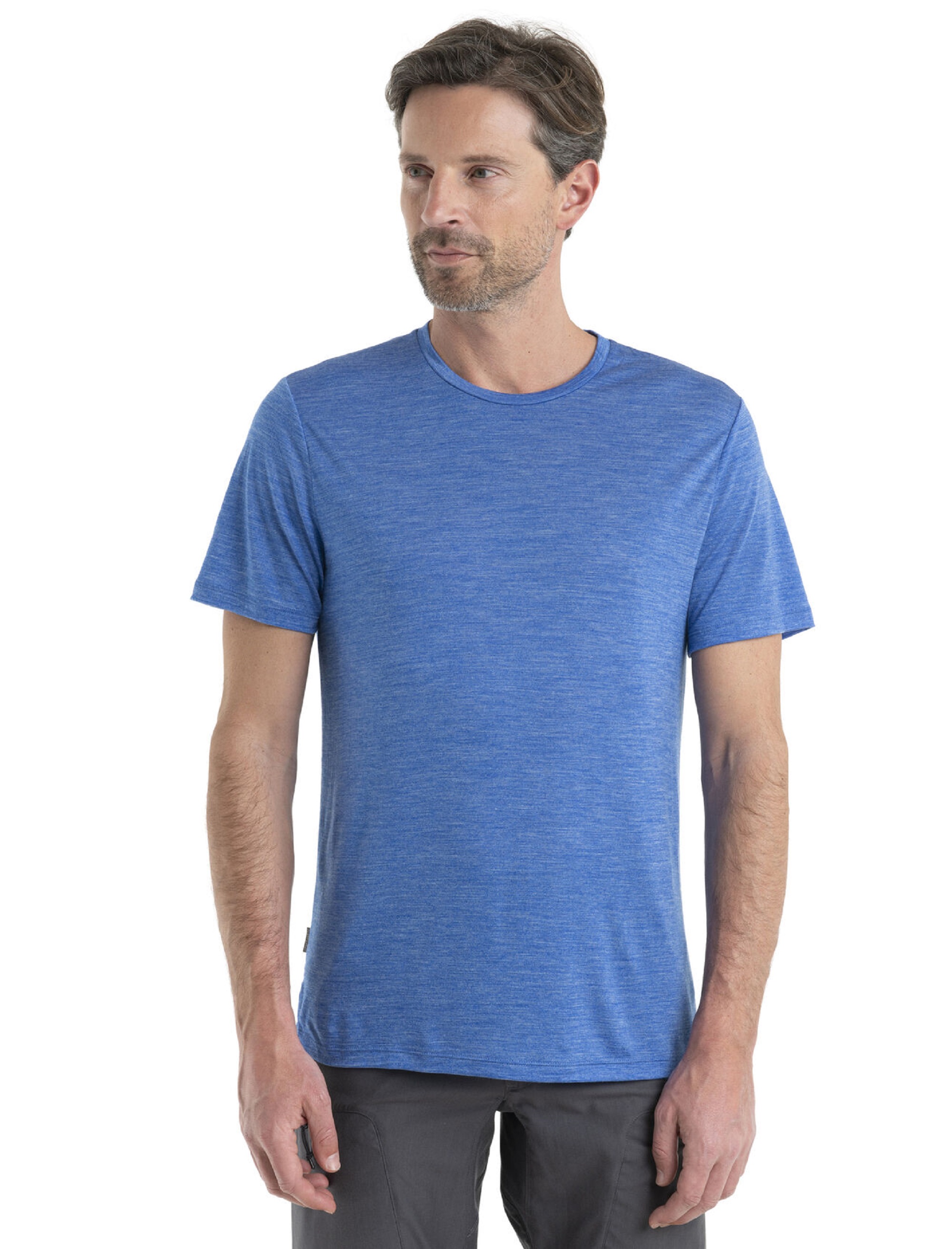 Man wearing a blue Icebreaker Sphere II T-shirt