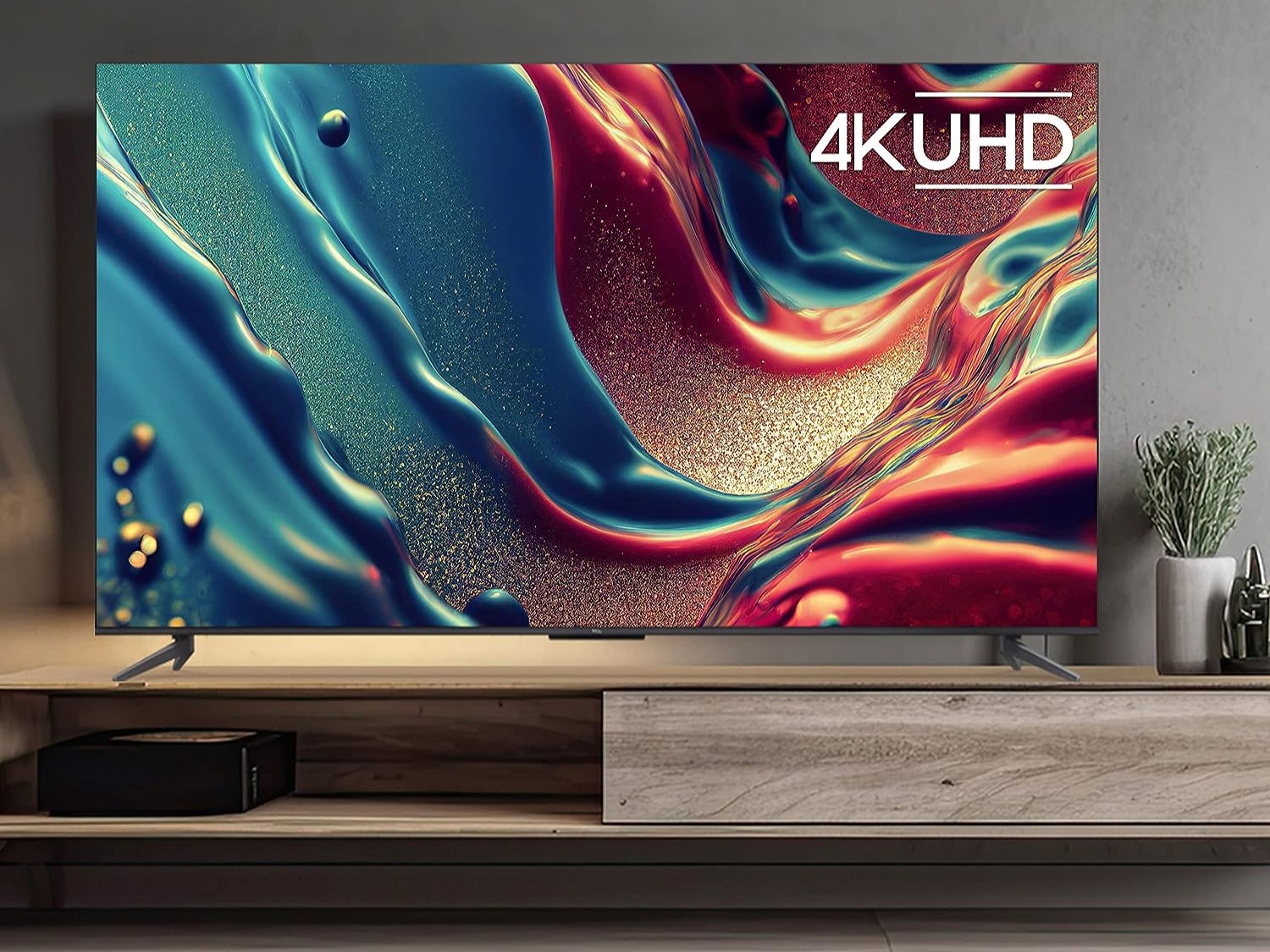 TCL 85 inch Q6 QLED 4K smart Google TV lifestyle image in living room.
