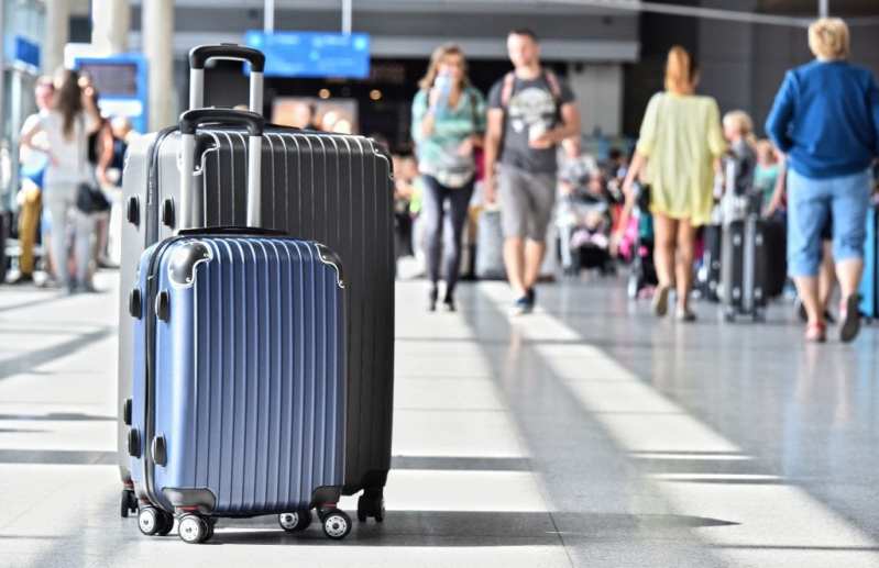 Two of the Travelhouse suitcases in an airport.
