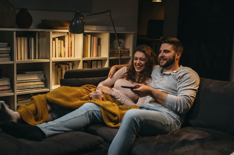 couple watching tv at home