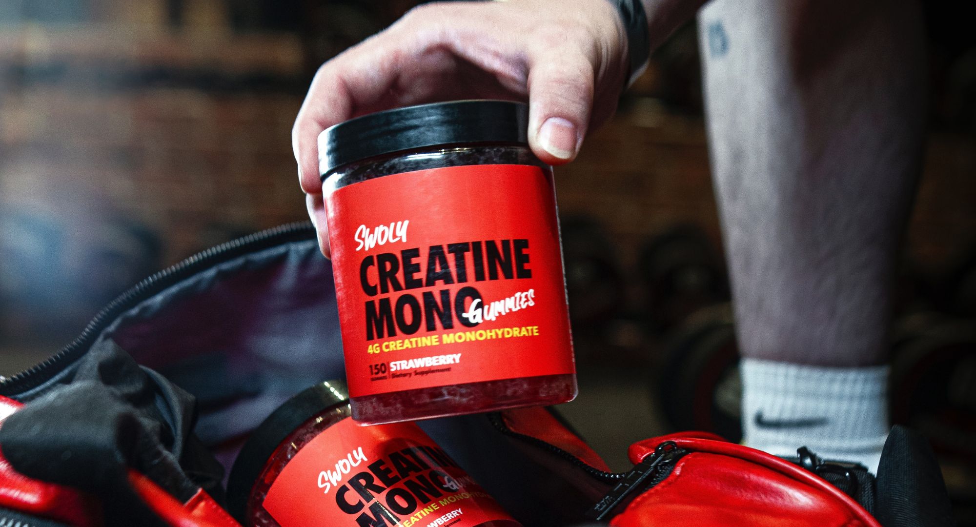 Man holding creatine supplements