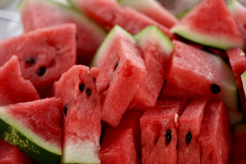 Sliced watermelon in a pile.