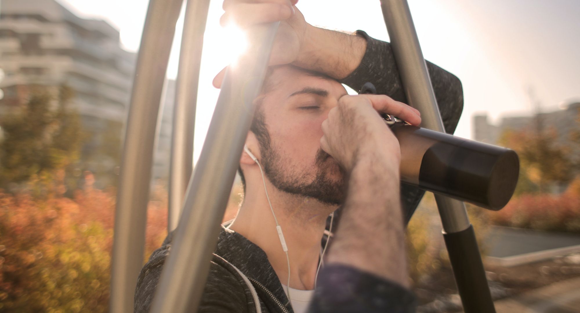 Man drinking water in the sunlight