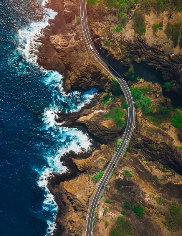 an ariel shot of mountains and ocean landscape on saddle road in hawaii 