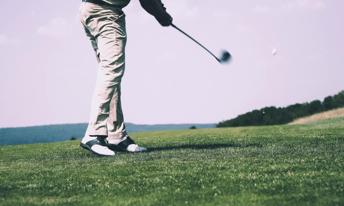 Man swinging a golf club