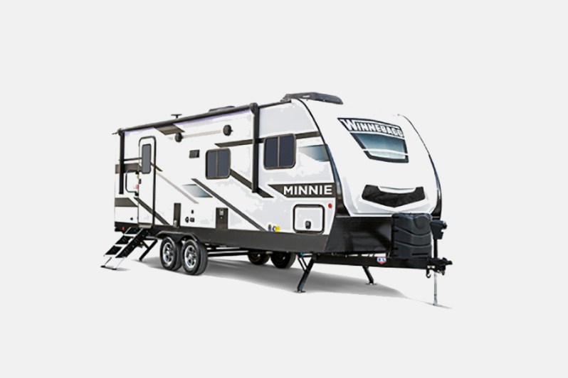 Winnebago Minnie Winnie travel trailer isolated against a plain studio background.