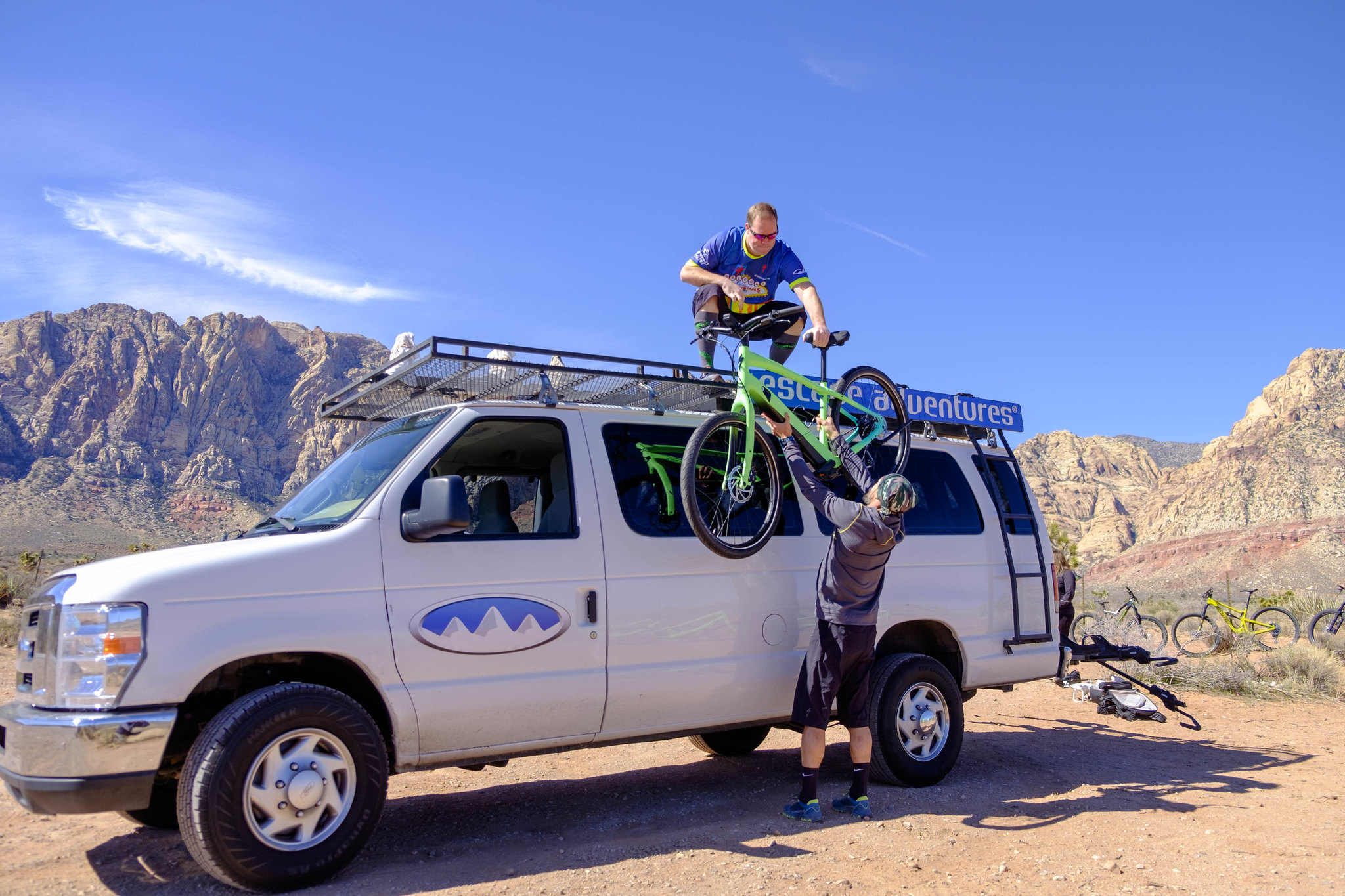 Unloading bikes from an Escape Adventures shuttle van